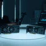 A technician reviews benchmark charts beside two AI accelerator boards, illustrating competition in the AMD AI chip market.