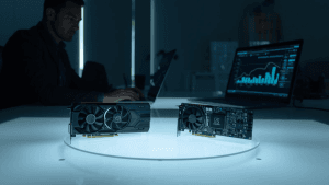 A technician reviews benchmark charts beside two AI accelerator boards, illustrating competition in the AMD AI chip market.